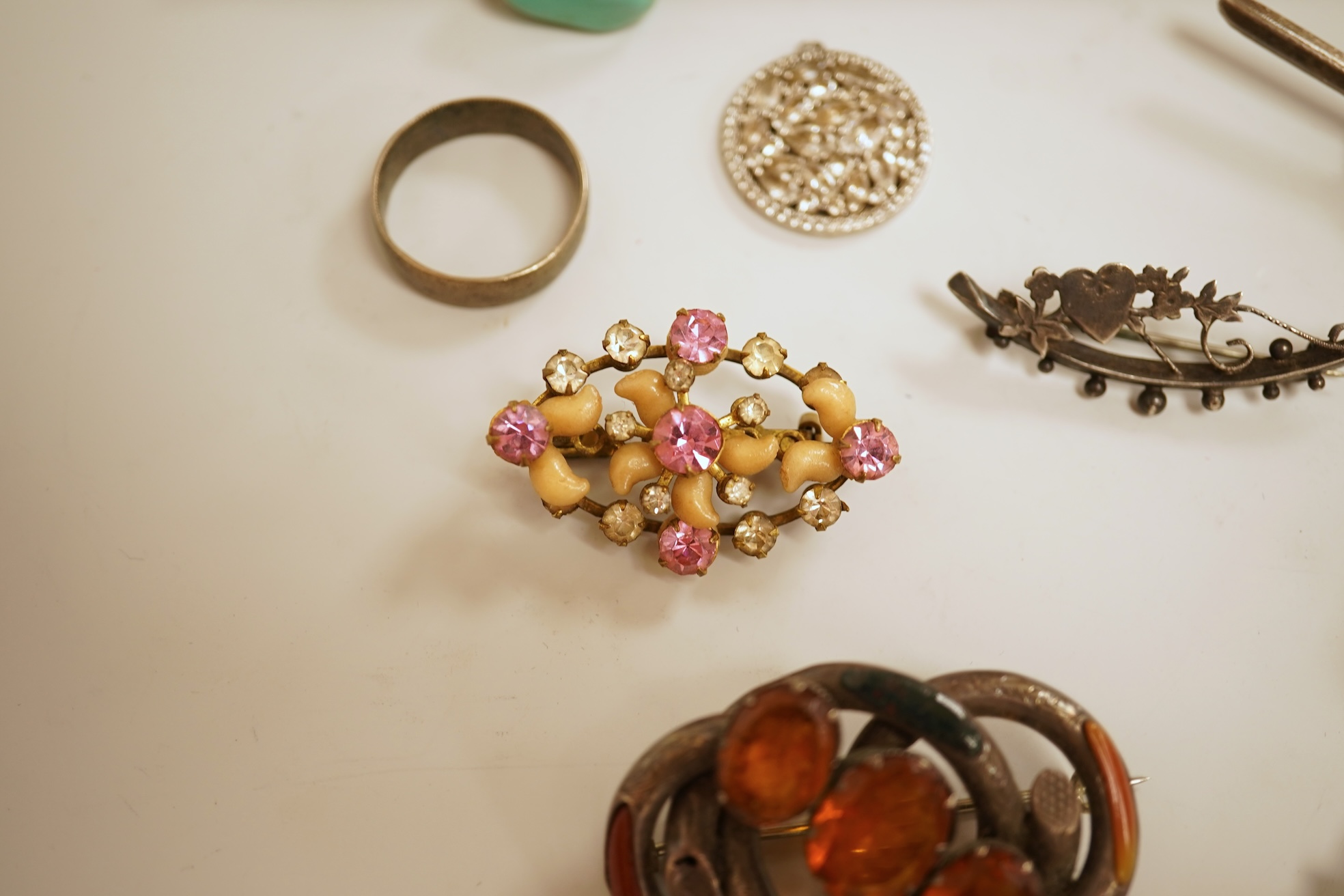 A small group of assorted jewellery including a gold plated curb link bracelet, silver brooch, simulated pearl necklace and costume.